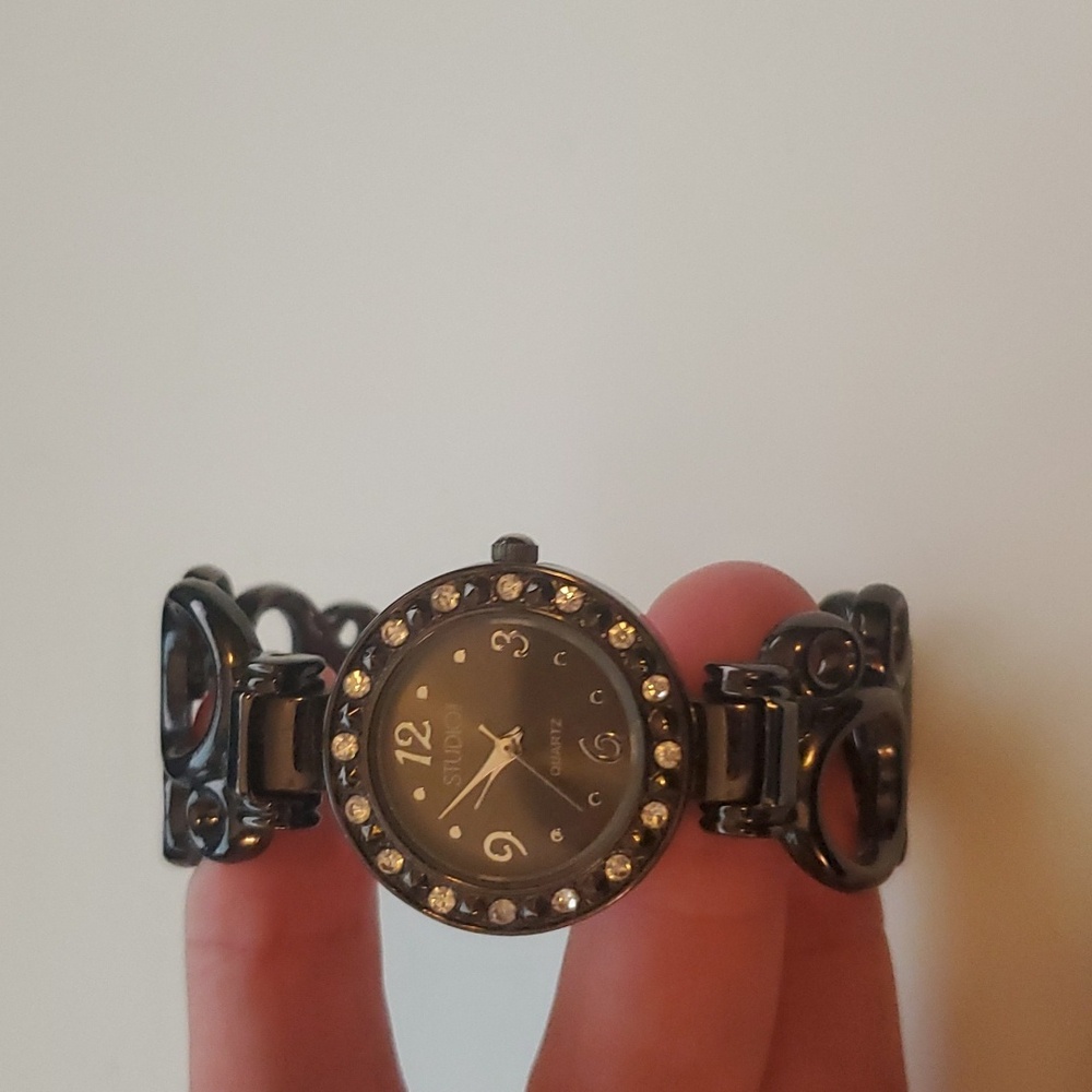 Black metal clasp watch